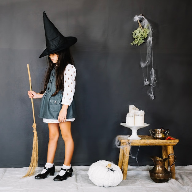 Free photo little witch with broom