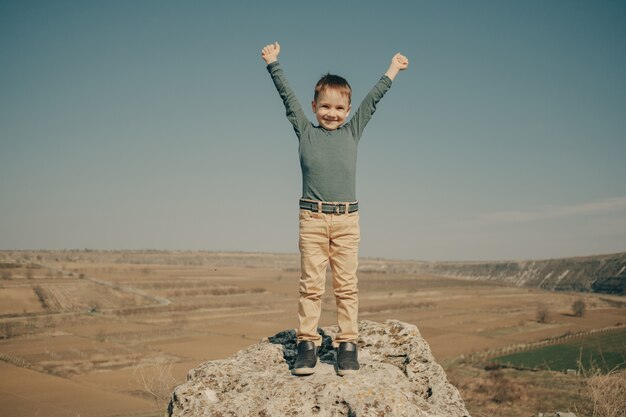 Little young caucasian boy in nature, childhood