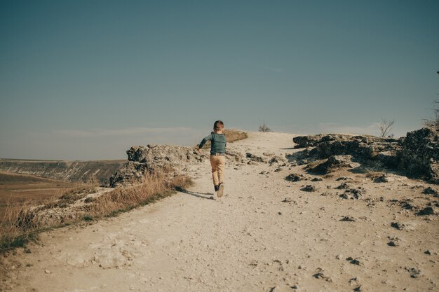 Little young caucasian boy in nature, childhood