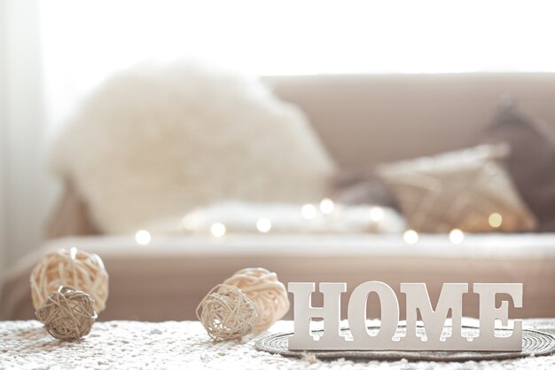 Living room with the inscription home ornament and light garland