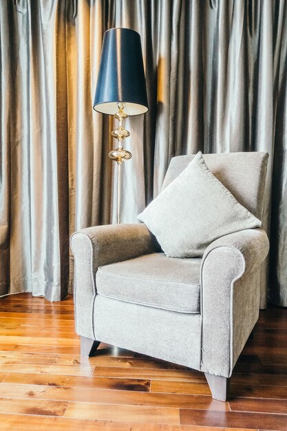 Living room with wooden floor and a grey armchair