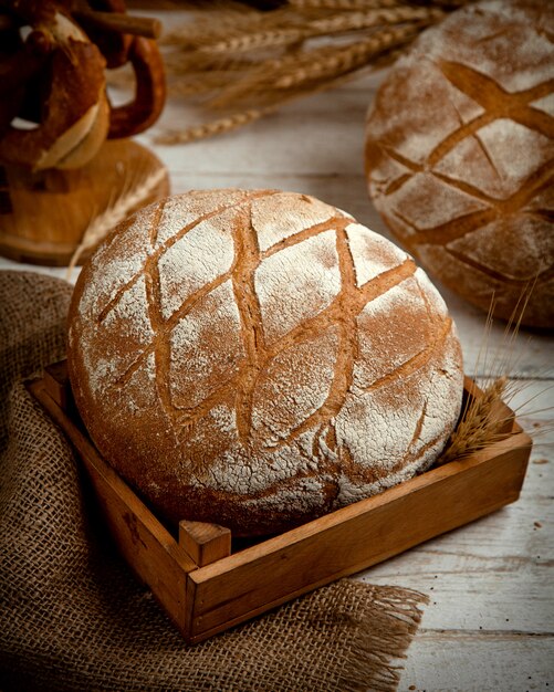 Loaf of bread topped with flour _