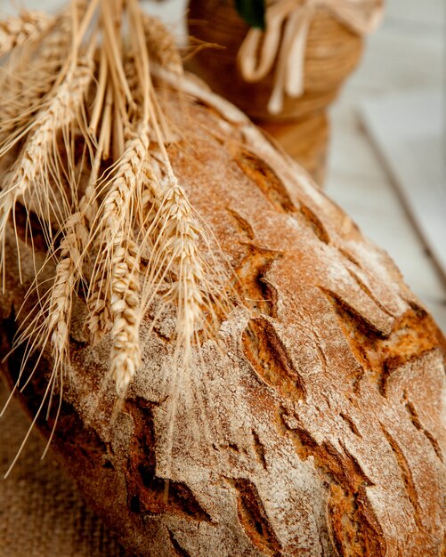 Loaf of bread with  wheat branch