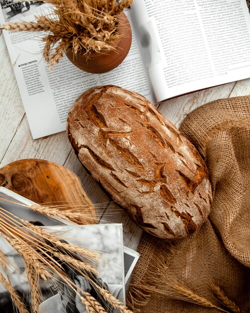 Loaf of bread on wooden table