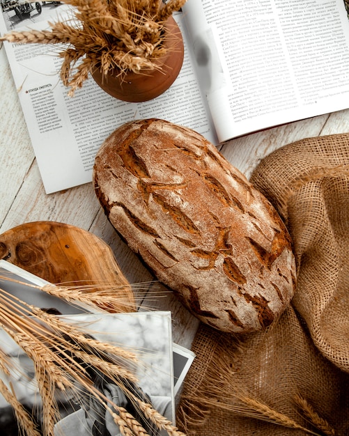 Loaf of bread on wooden table