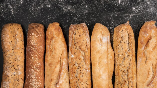 Loaves of bread on black background