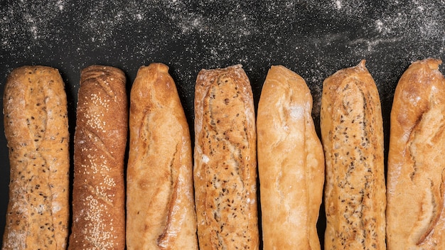 Loaves of bread on black background