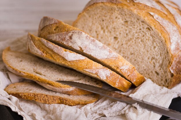 Loaves of bread and knife front view