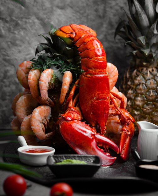 lobster served with tiger prawns and sauces