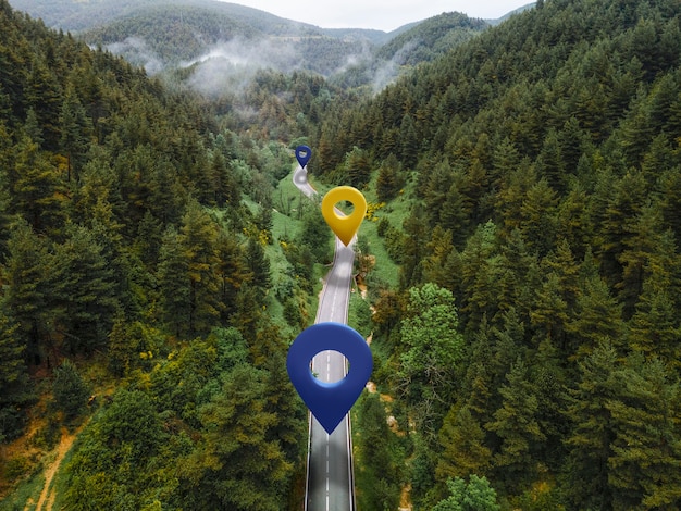 Location symbols on road with mountains