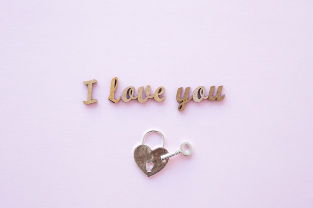 Free photo lock and key near i love you writing