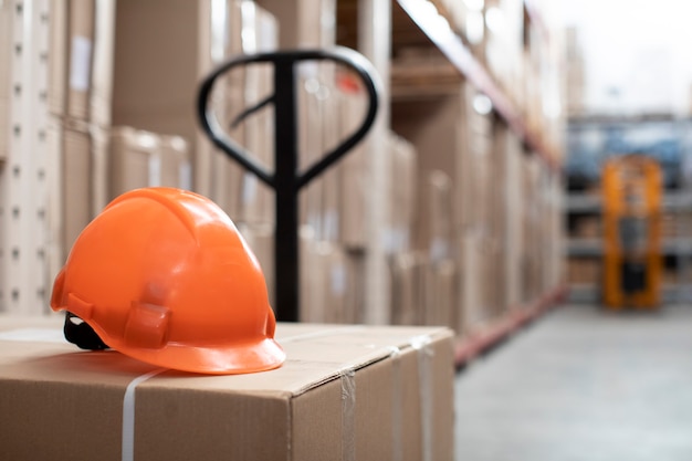 Free photo logistic warehouse concept with orange helmet