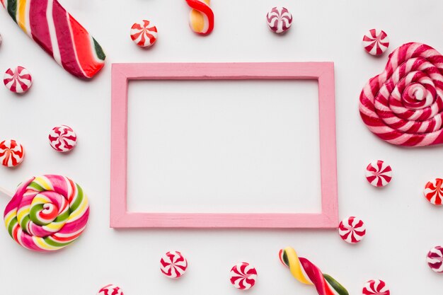 Lollipops and candies with frame and copy space