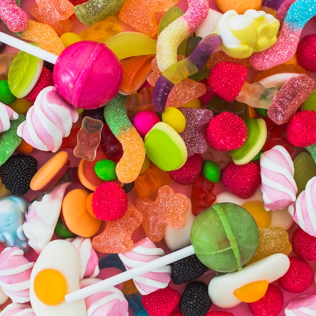 Foto gratuita lollipops, vermi di gelatine e bacche