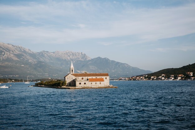 Lonely church on the island in the middle of a lake