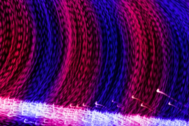 Long exposure of curve blue and pink light trail background