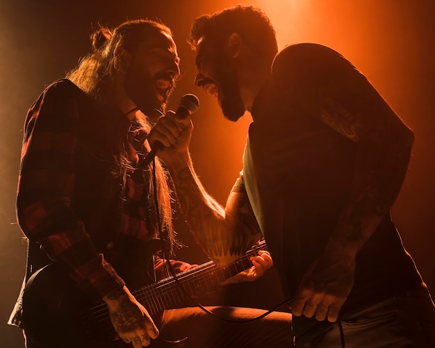 Long hair guitar guy and vocalist duet singing