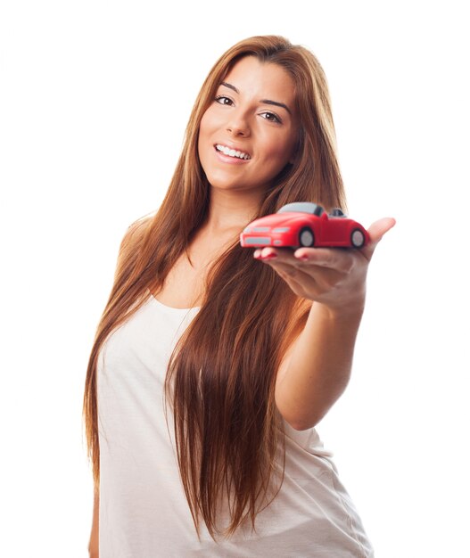 Long haired beauty with tiny car