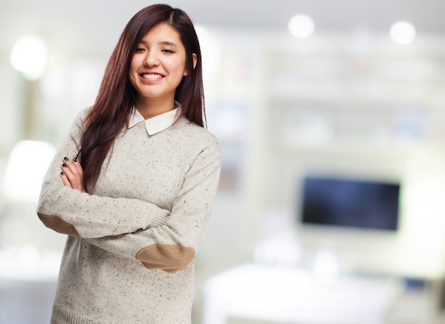 Long-haired teen with crossed arms