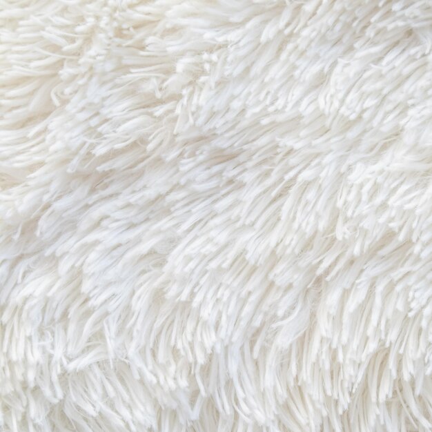 Long pile carpet texture. abstract background of shaggy white fibers. high quality photo Premium Photo