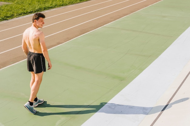 Long shot of athlete at the running track