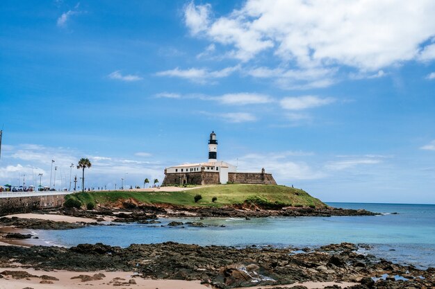 Long shot of Bahia Nautico Museum in Salvdor, Brazil, under cloudy blue skies