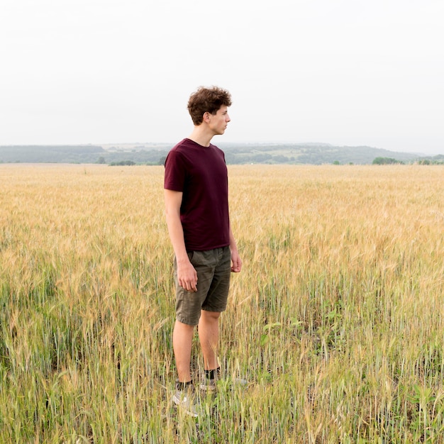 Long shot of boy in nature concept