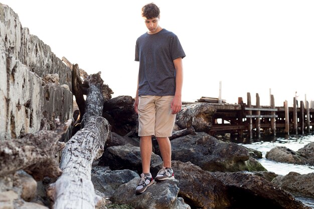 Long shot of boy relaxing at sea