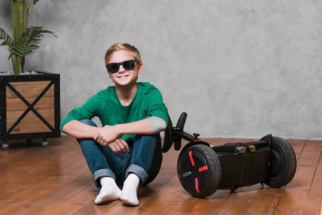 Long shot of boy with hoverboard