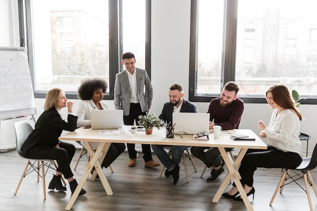 Long shot of business people in meeting