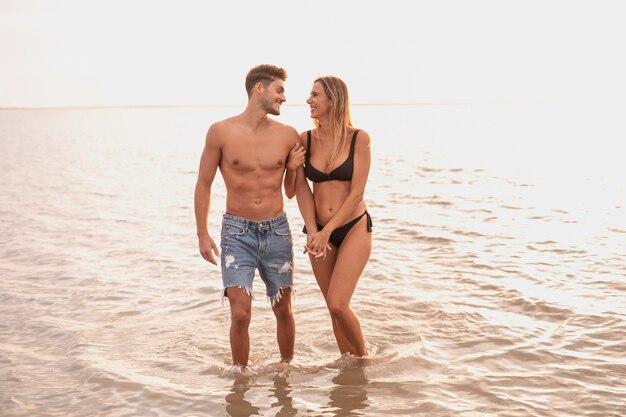Long shot of couple spending time in water