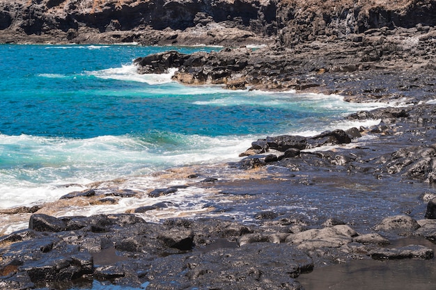 Long shot crystalline water on wild beach