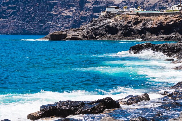 Long shot crystalline water on wild beach