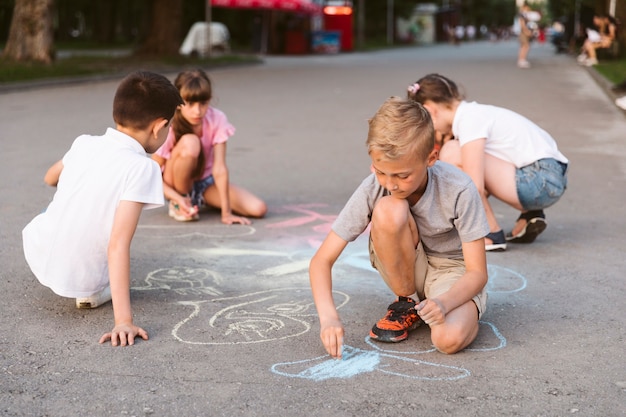 Long shot friends drawing with chalk