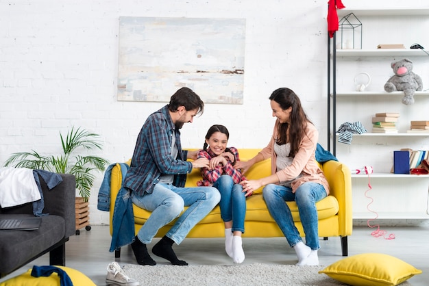 Long shot of happy family in living room