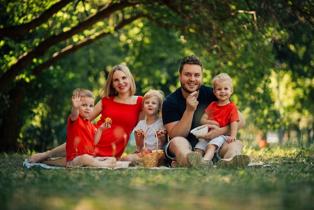 Long shot happy family looking at camera