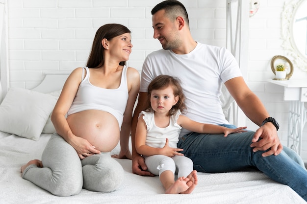 Long shot happy family spending time together at home