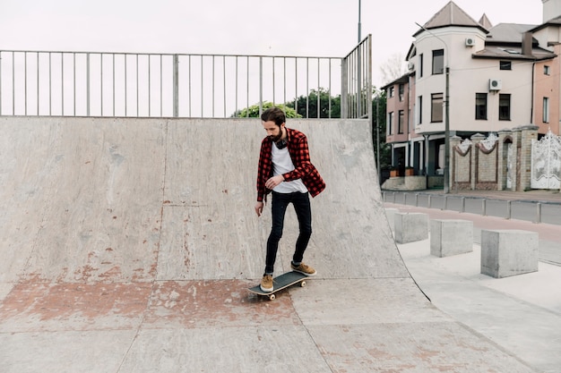 Long shot of man at skate park