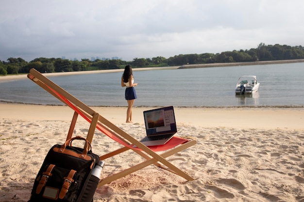 Free photo long shot nomad woman at seaside