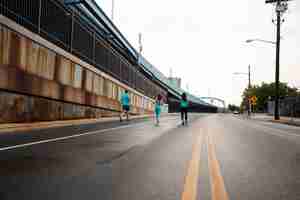 Free photo long shot people running on street