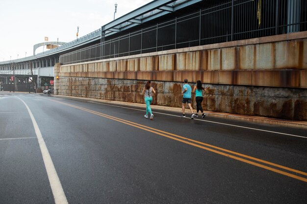 Long shot people running together