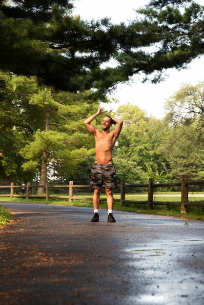 Long shot of runner in park