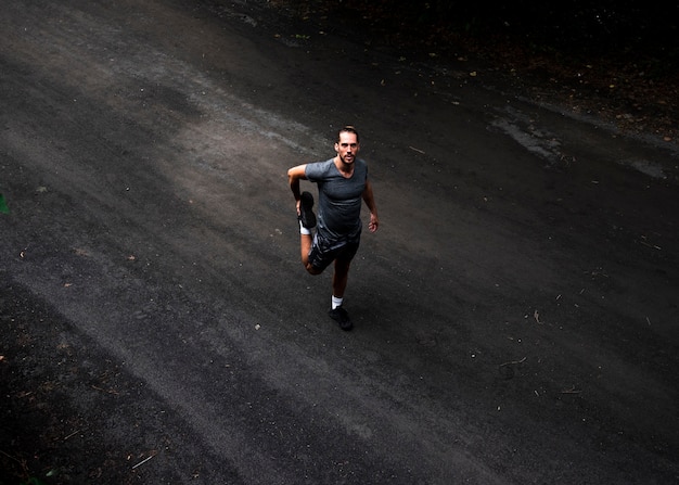 Long shot of runner stretching