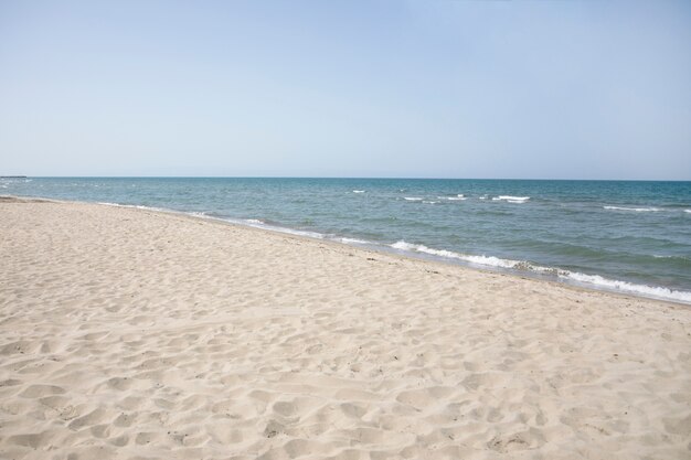 Long shot of the seashore on summer beach