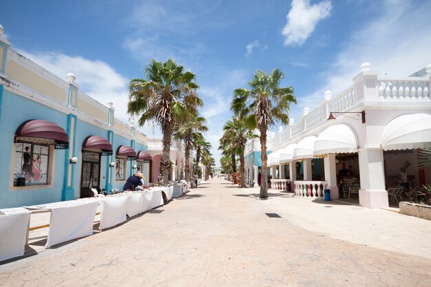 Long shot of street in tropical tourist resort