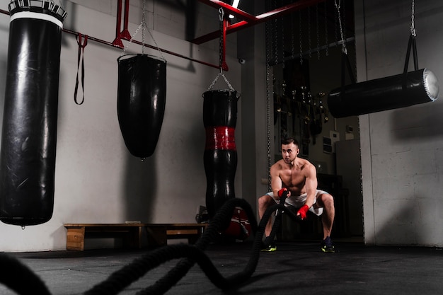 Free photo long shot strong boxer training for a competition