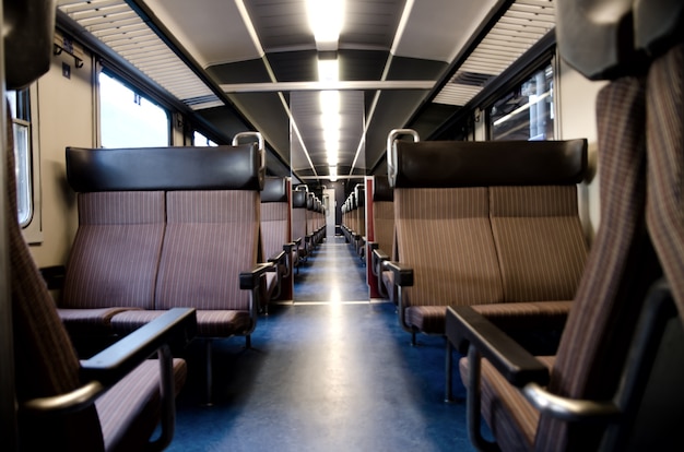 Long shot of a train isle with empty seats