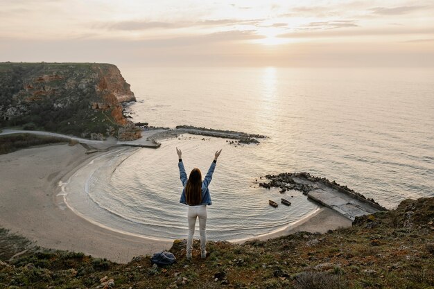 Long shot of woman enjoying the peace around her