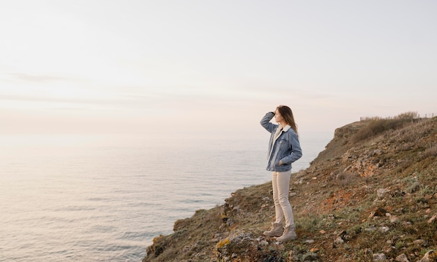 Long shot of woman enjoying the peace around her