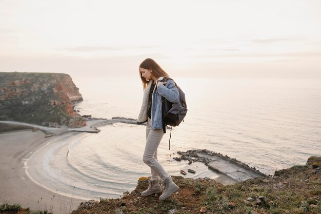 Long shot of woman enjoying the peace around her